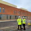 Ian Burke, Project Director from IHP and Jo Southwell, the Trust's Capital Project Lead, standing at the front of the new UECC.
