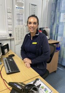 Melissa at her desk in the ED.