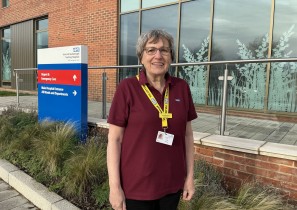 Sue standing in front of the entrance to Scarborough's UECC.