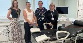 Four members of the Early Pregnancy Assessment Unit team standing in one of the new examination rooms