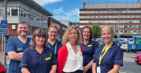 Trust colleagues standing at the front of York Hospital's main entrance.
