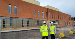 Ian Burke, Project Director from IHP and Jo Southwell, the Trust's Capital Project Lead, standing at the front of the new UECC.