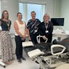Four members of the Early Pregnancy Assessment Unit team standing in one of the new examination rooms