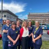 Trust colleagues standing at the front of York Hospital's main entrance.