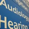 Internal blue hospital signage with the text 'Audiology' on