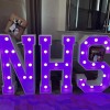 Light up giant letters spelling 'NHS'