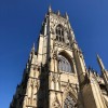 Looking up at one of York Minster's towers on a clear sunny day.