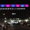 York Hospital main entrance at night. Its lights are in pink and blue to represent Baby Loss Awareness Week.