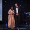 Liz onstage with the Trust's Chief Executive, Simon Morritt, to receive her award.