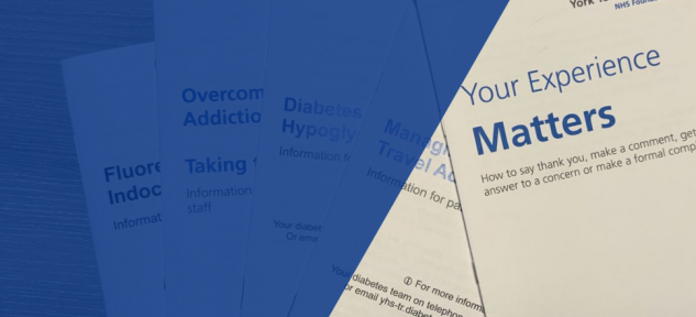 Collection of patient information leaflets fanned out on a desk.