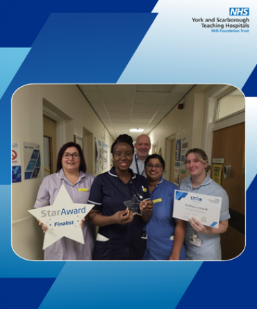 Star Award winners Mulberry Ward receiving their award from Simon Morritt, Chief Executive.