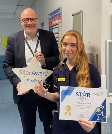 Star Award winner, Emily Poppleton, receiving her award from Simon Morritt, Chief Executive.