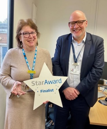 Star Award winner, Sharon McDade, receiving her award from Simon Morritt, Chief Executive.