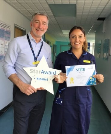 Star Award winner, Rose Kay, receiving her award from Andrew Bertram, Finance Director.
