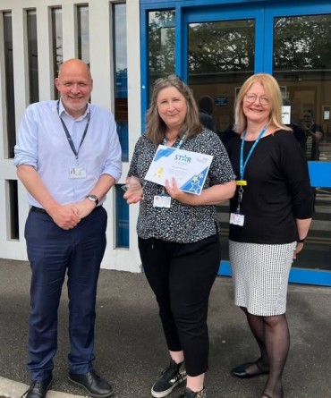 Star Award winner Nicola Wilson receiving her award from Simon Morritt, Chief Executive, and a colleague.