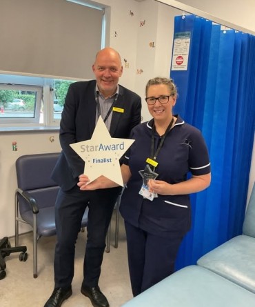 Star Award winner Samantha Kelly receiving her award from Simon Morritt, Chief Executive.