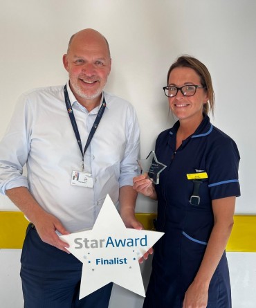 Star Award winner Suzi Greening receiving her award from the Trust's Chief Executive, Simon Morritt.