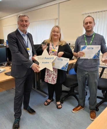 Star Award winners Beverley Senturk and Ross Morton receiving their award from the Trust's Interim Chief Executive, Andrew Bertram.