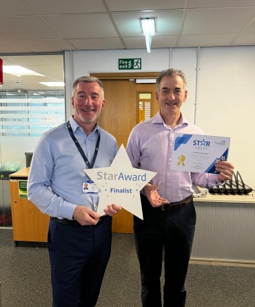 Star Award winner Jamie Baxter receiving his award from the Trust's Interim Chief Executive, Andrew Bertram.