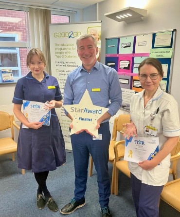 Star Award winners Joanne Gill and Saffron Snowden receiving their awards from Andrew Bertram, the Trust's Interim Chief Executive.