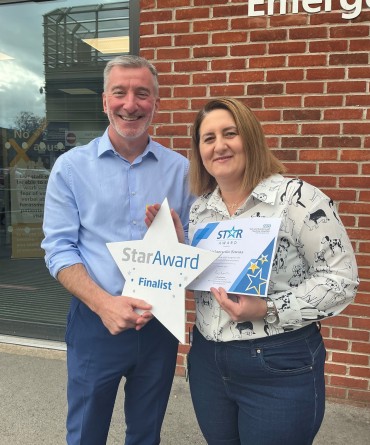 Star Award winner Margaret Banas receiving her award from Andrew Bertram, the Trust's Interim Chief Executive.