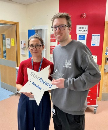 Star Award winner, Rhett Richardson, receiving his award from Clare Smith, Chief Executive.