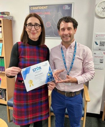 Star Award winner, Robin Hughes, receiving his award from Clare Smith, Chief Executive.