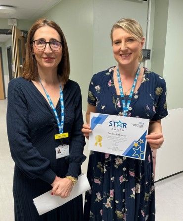 Star Award winner, Emma Falconer, receiving her award from Chief Executive, Clare Smith.