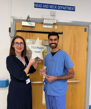 Star Award winner Jitesh Jassal receiving his award from Clare Smith, Chief Executive.