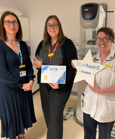 Star Award winner Michelle Lee receiving her award from Clare Smith, Chief Executive, and her nominator, Elanor Kitchen.