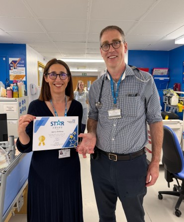 Star Award winner Gerry Robins receiving his award from Clare Smith, Chief Executive.