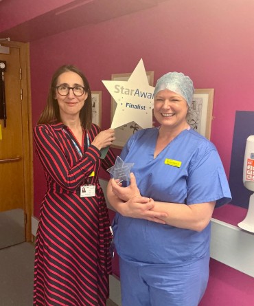 Star Award winner Victoria Beckitt receiving her award from Clare Smith, Chief Executive.