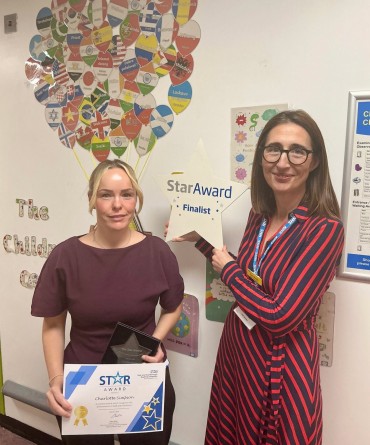 Star Award winner Charlotte Simpson receiving her award from Clare Smith, Chief Executive.