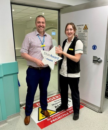 Star Award winner Lotty Barks receiving her award from Joe Hague, Chief Nurse.