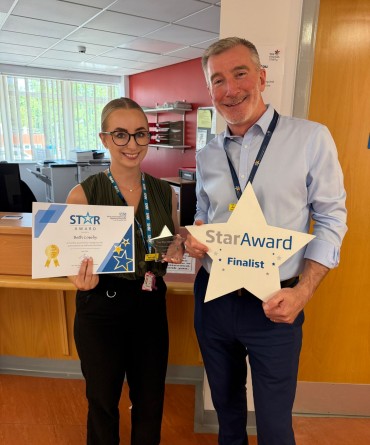 Star Award winner Beth Loseby receiving her award from Finance Director, Andrew Bertram.