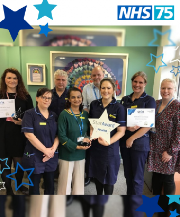 The Palliative Care and Bereavement Team receiving their Star Award from Simon Morritt.