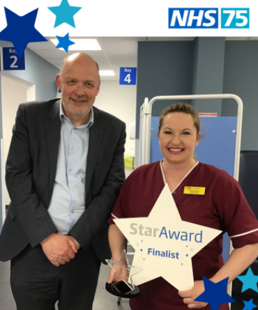 Samantha Reddy receiving her Star Award from Simon Morritt.