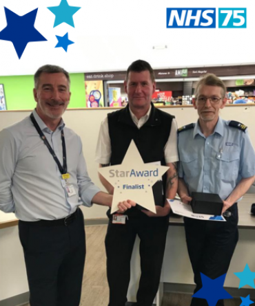 Adrian Gray and Craig Wilson receiving their Star Award from Andrew Bertram.
