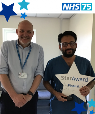 Mr Effendi receiving his Star Award from Simon Morritt.