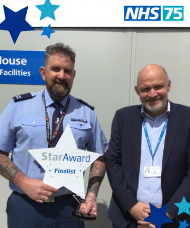 Rich Atkinson receiving his Star Award from Simon Morritt.