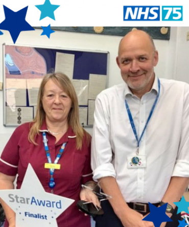 Theresa Bradshaw receiving her Star Award from Simon Morritt, the Trust's Chief Executive.