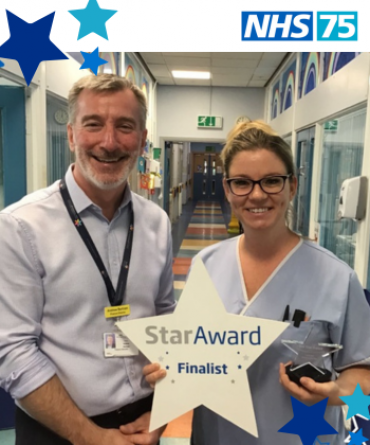 Emma Barber receiving her Star Award from Andrew Bertram, Finance Director of the Trust.