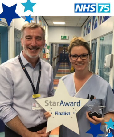 Emma Barber receiving her Star Award from Andy Bertram, Finance Director of the Trust