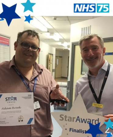 Adam Brook receiving a Star Award from Andrew Bertram the Trust's Finance Director.