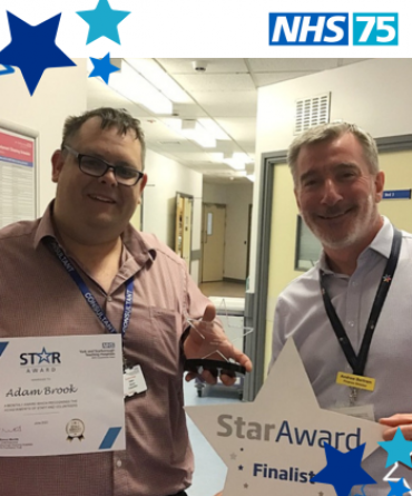 Adam Brook receiving a Star Award from Andy Bertram the Trust's Finance Director