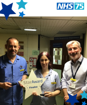 Star Award winners Clinton Cooper and Lyndsay Crossman receiving their award from Andrew Bertram the Trust's Finance Director.