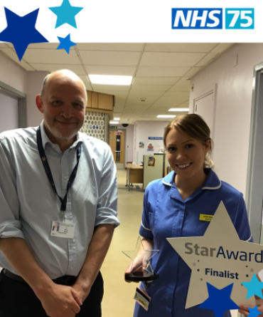Star Award winner Victoria Beattie receiving her award from Simon Morritt, the Trust's Chief Executive.