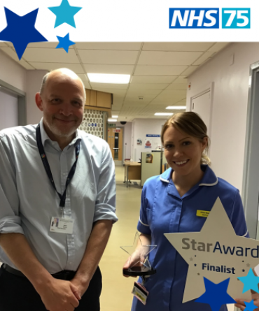 Star Award winner Victoria Beattie receiving her award from Simon Morritt, the Trust's Chief Executive