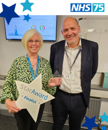 Star Award winner Gill Cryle receiving her award from Simon Morritt, the Trust's Chief Executive.