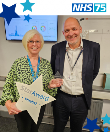 Star Award winner Gill Cryle receiving her award from Simon Morritt, the Trust's Chief Executive